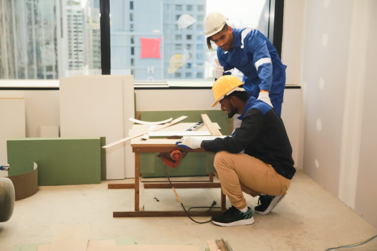 Tradespeople cutting timber during an interior fit-out